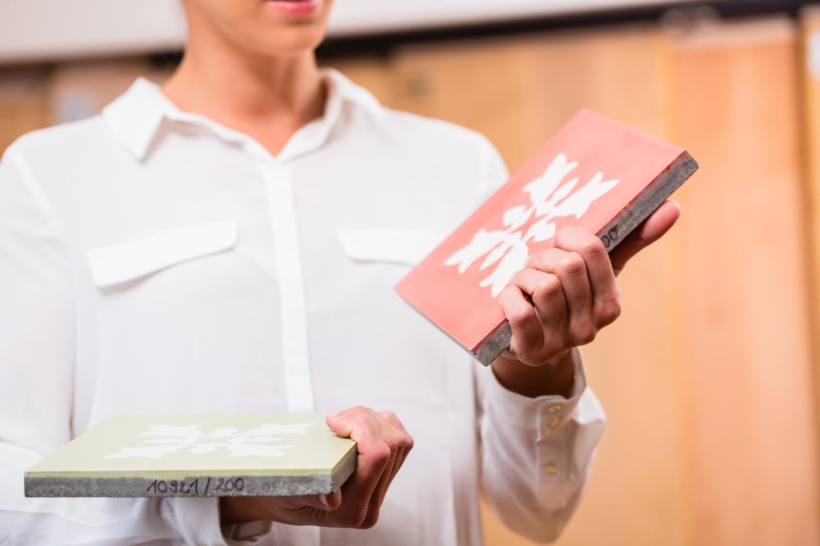 Interior Designer with cement floor tiles in home improvement store